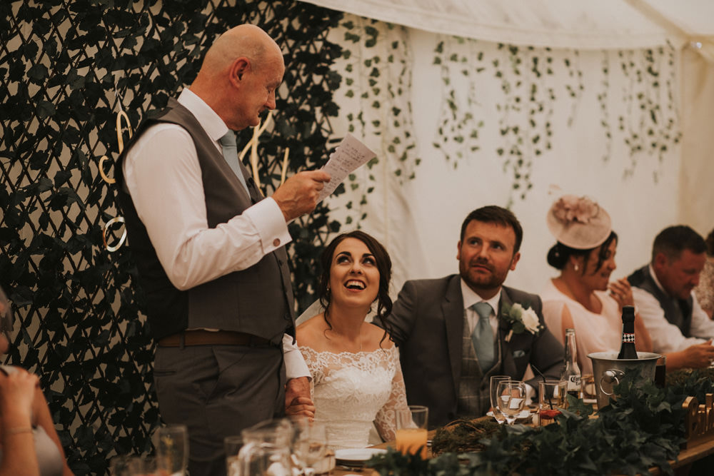 Outdoor Farm Field Wheat Rustic Garden Marquee Foliage Garland Backdrop Wooden Trestle Speeches | Fun and Relaxed Scrivelsby Walled Garden Wedding Brook Rose Photography