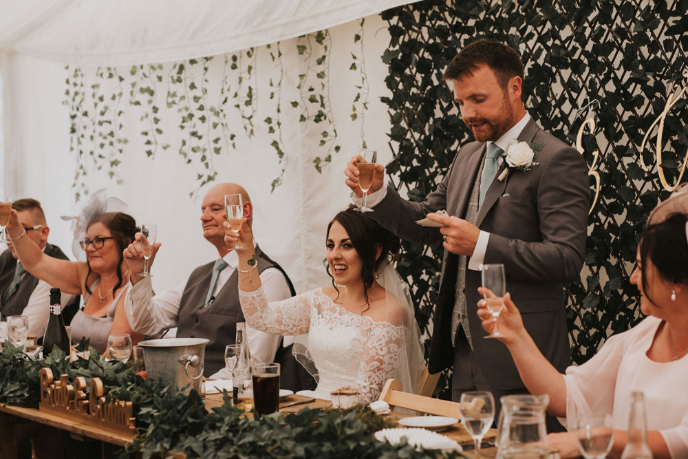 Outdoor Farm Field Wheat Rustic Garden Marquee Foliage Garland Backdrop Wooden Trestle Speeches | Fun and Relaxed Scrivelsby Walled Garden Wedding Brook Rose Photography