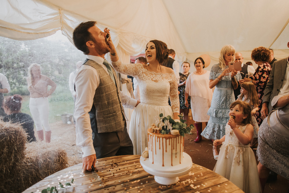 Outdoor Farm Field Wheat Rustic Garden Marquee Bride Groom Cake Cutting | Fun and Relaxed Scrivelsby Walled Garden Wedding Brook Rose Photography