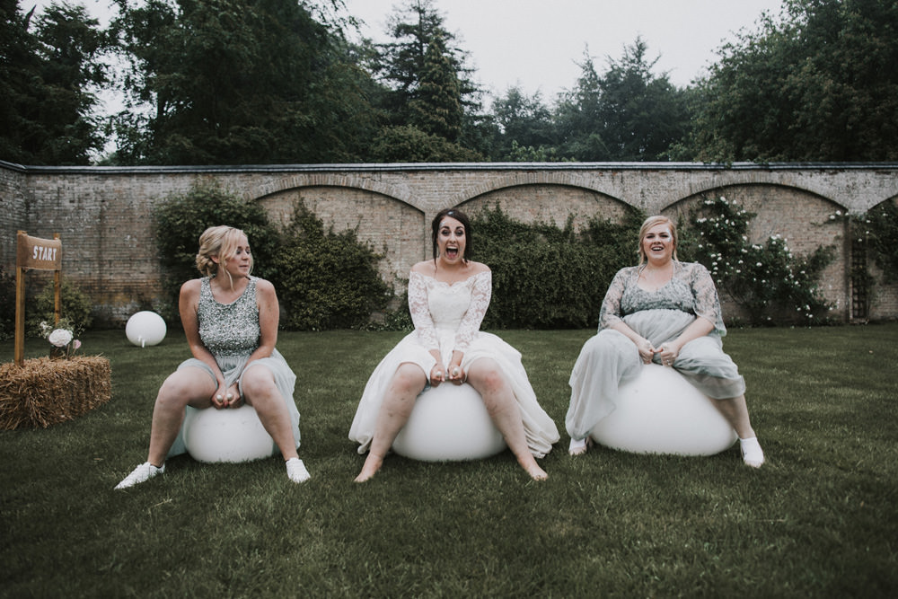 Outdoor Farm Field Wheat Rustic Garden Marquee Bride Bridesmaids Space Hoppers | Fun and Relaxed Scrivelsby Walled Garden Wedding Brook Rose Photography