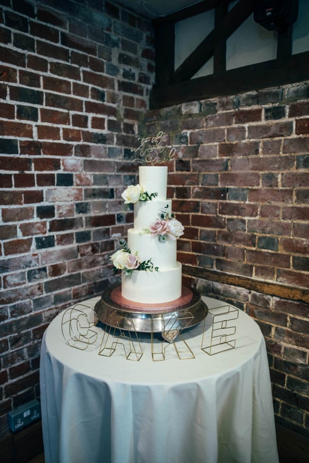 Tall Iced Cake Modern Flowers Warm Welcoming Wedding Three Flowers Photography