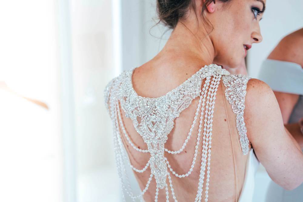 Pronovias Dress Gown Bride Bridal Train Sleeveless Pearl Back Necklace Warm Welcoming Wedding Three Flowers Photography