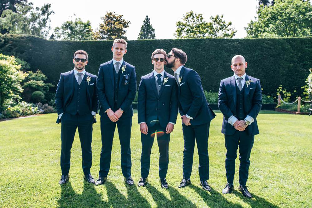 Groom Suit Navy Blue Groomsmen Polka Dot Tie Warm Welcoming Wedding Three Flowers Photography
