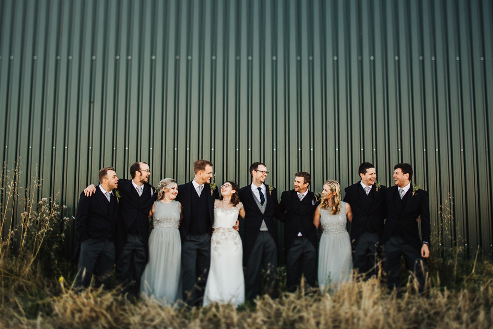 Bride Bridesmaids Groom Groomsmen Group Shot Whimsical Countryside Sperry Tent Wedding Emilie May Photography