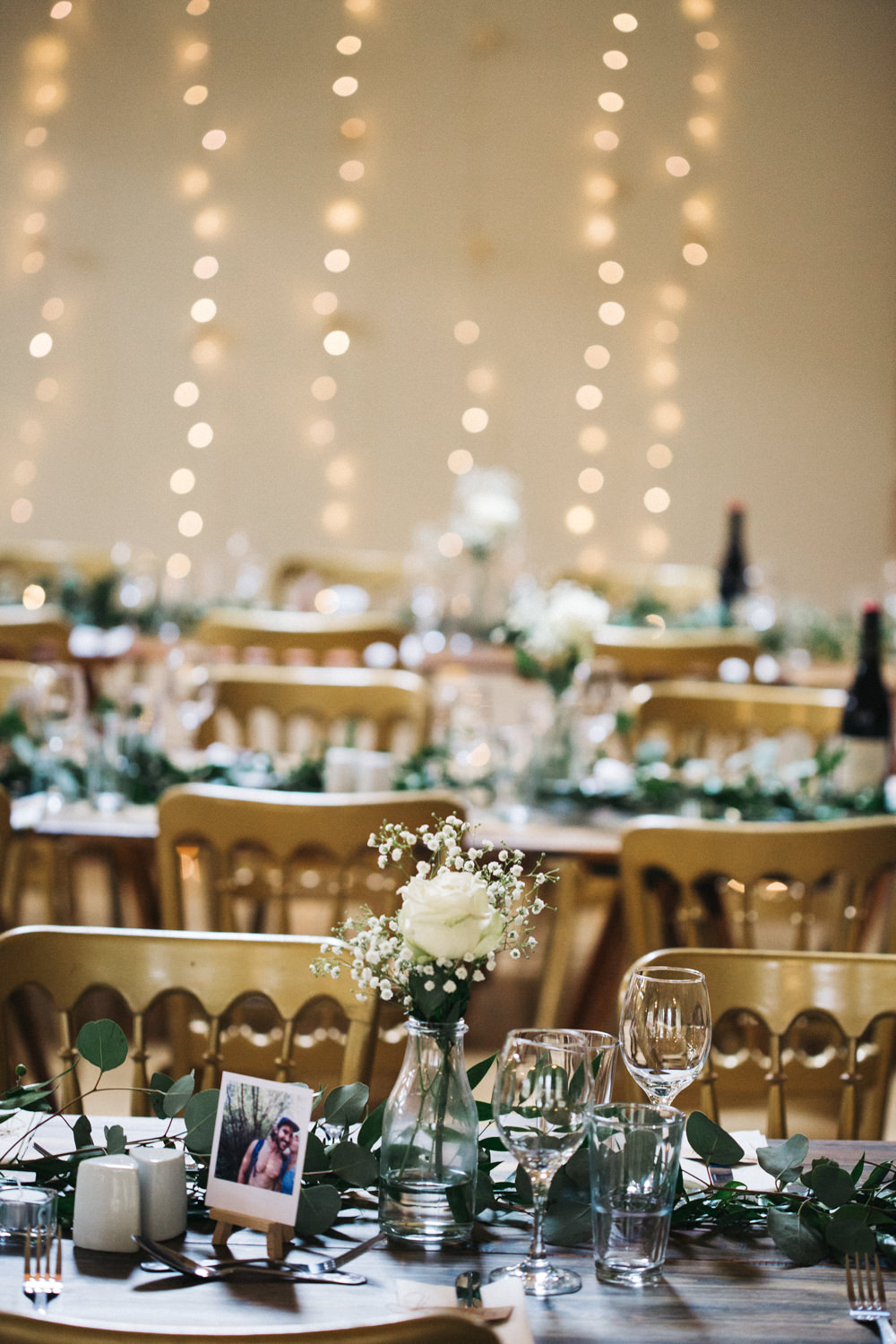 Milk Bottle Flowers White Rose Gypsophila Greenery Swag Runner Table Fairy Lights Wray's Barn Whinstone View Wedding Sally T Photography