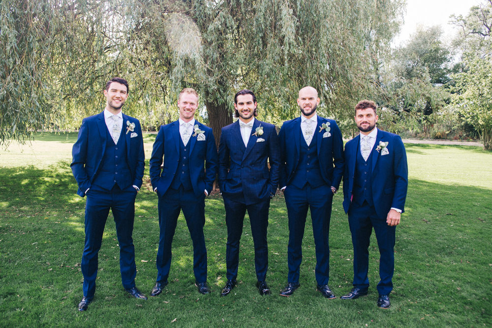 Groom Groomsmen Check Suits Navy Floral Bow Tie Wray's Barn Whinstone View Wedding Sally T Photography