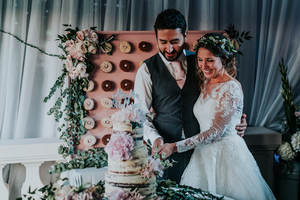 Bride Bridal Lace Long Sleeve Dress Flower Foliage Crown Grey Waistcoat Groom Cake Cutting Donut Wall Alrewas Hayes Wedding David Boynton Photography