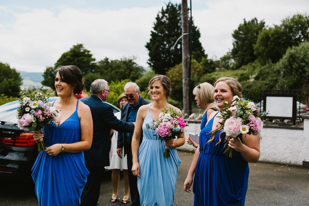 Blue Strappy Beach Bespoke Bridesmaids Dresses Multicoloured Bouquets Anna Carriga Wedding Honey and the Moon Photography