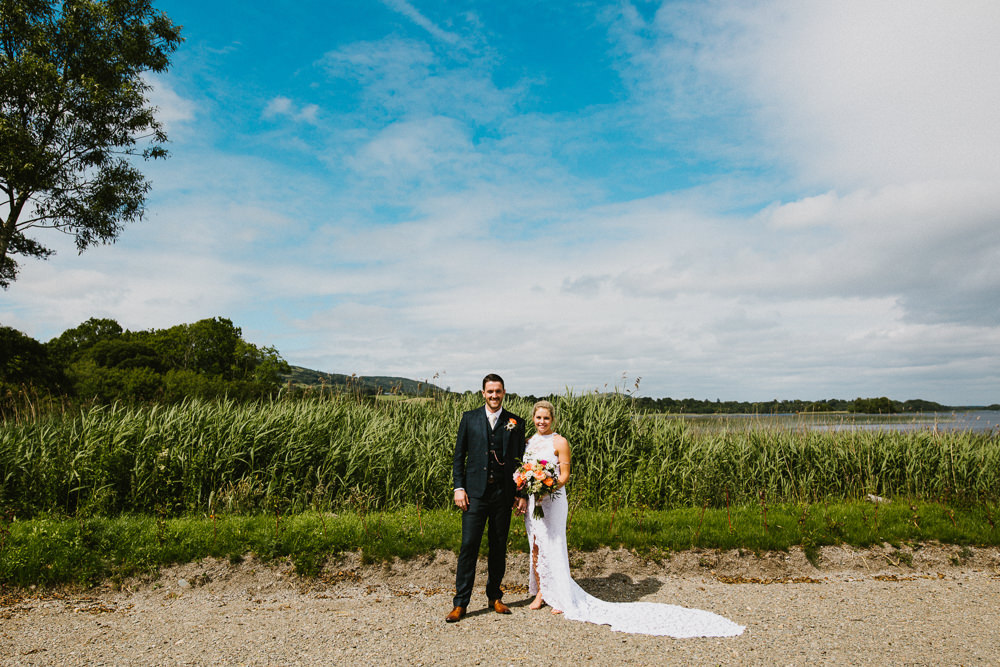 Bride Bridal Grace Loves Lace Dress Halter Neck Long Train Short Front Asymmetric Three Piece Navy Suit Groom Multicoloured Bouquet Anna Carriga Wedding Honey and the Moon Photography