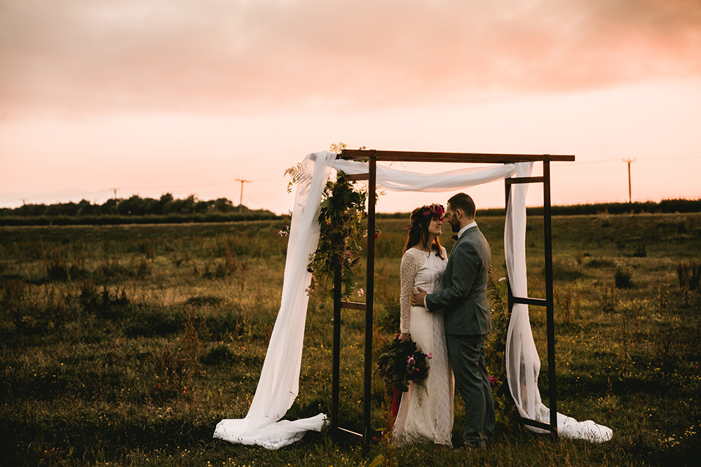 Flower Arch Backdrop Flowers Dark Red Burgundy Marsala Oxblood Pink Magenta Fabric Wooden Peony Peonies Rose Antique Moody Floral Farm Wedding Ideas Jemma King Photography