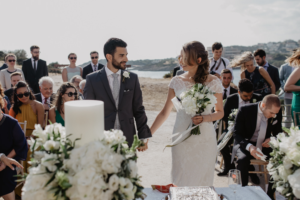 Bride Bridal Fishtail Lace Cap Sleeve Sweetheart Dress Gown Grey Suit Groom Candle Ceremony Greece Destination Wedding Elena Popa Photography