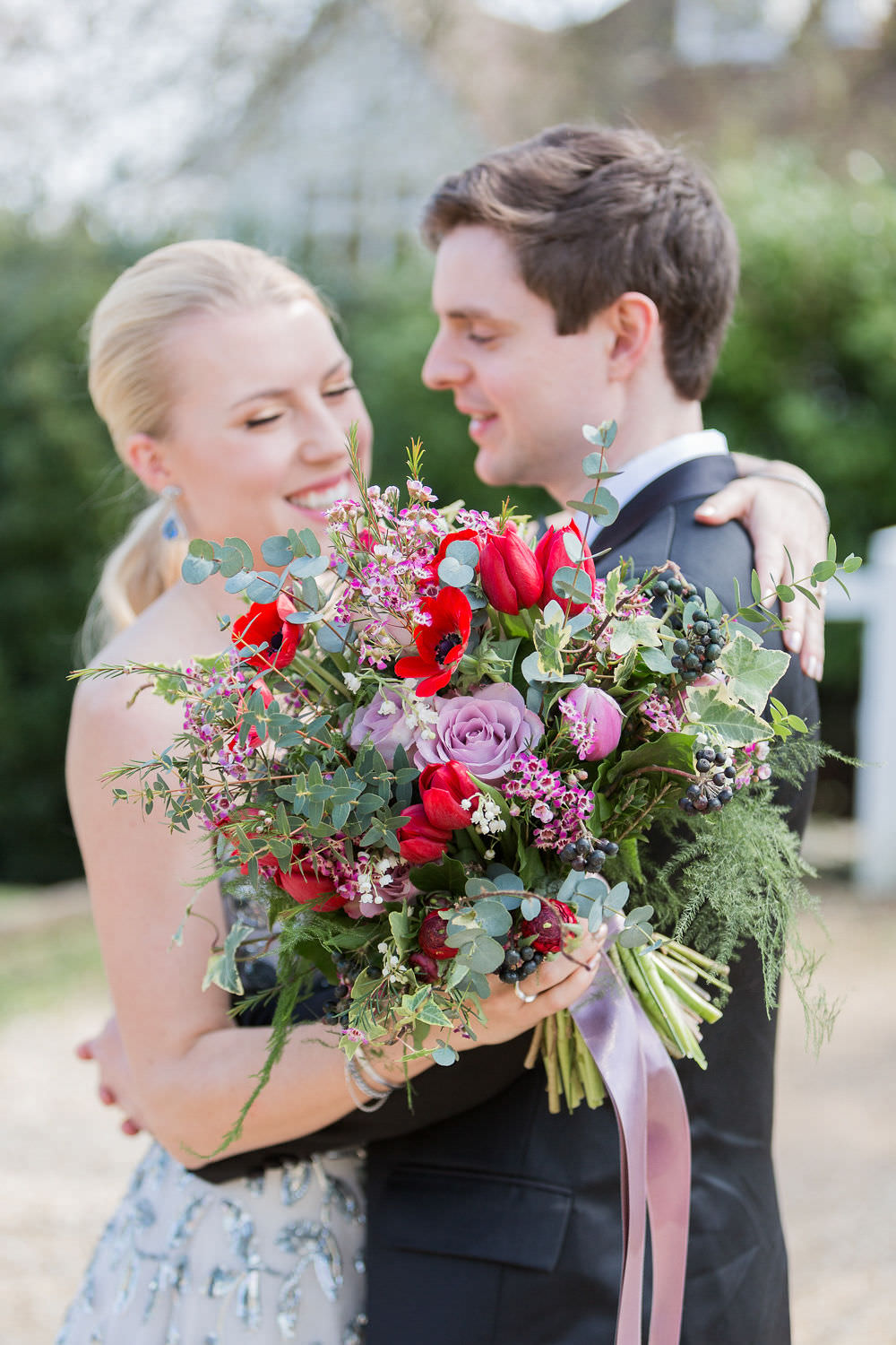 Bouquets Bride Bridal Bridesmaid Greenery Foliage Red Pink Rose Poppy Tulips Ribbons Highcliffe Castle Wedding Bowtie and Belle Photography