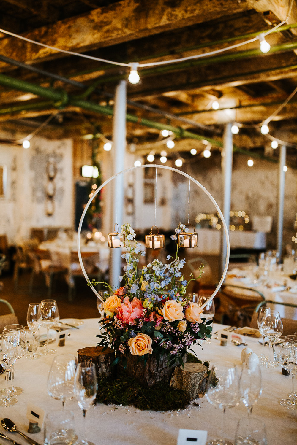 Centrepiece Hoop Circle Log Stand Flowers Moss Woodland Floral Peach Peony Coral Rose Candles Holmes Mill Wedding Emilie May Photography