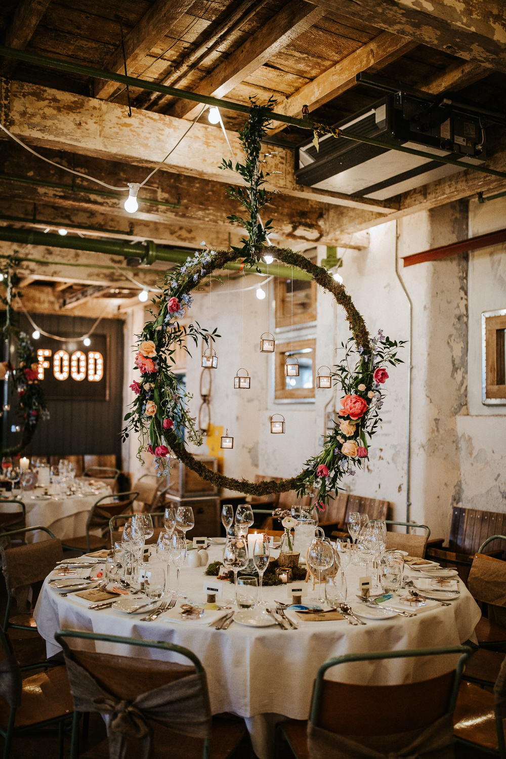 Suspended Hanging Centrepiece Hoop Circle Log Stand Flowers Moss Woodland Floral Peach Peony Coral Rose Candles Holmes Mill Wedding Emilie May Photography