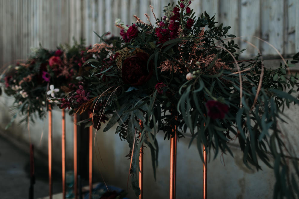 Suspended Hanging Flowers Table Decor Greenery Foliage Burgundy Industrial Luxe Wedding Ideas Balloon Installation Ayelle Photography