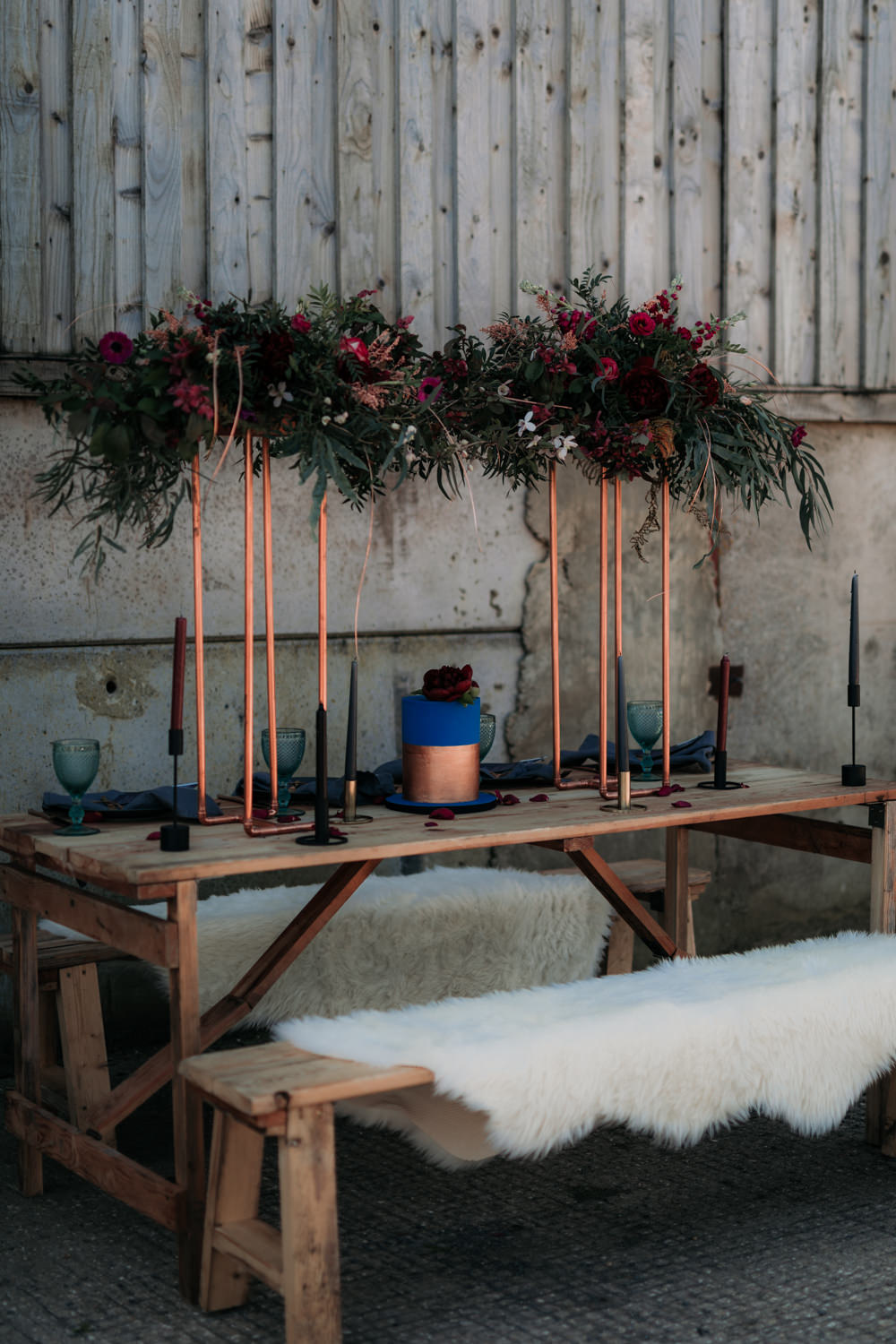 Table Set Up Tablescape Decor Suspended Flowers Copper Navy Blue Magenta Sheepskin Industrial Luxe Wedding Ideas Balloon Installation Ayelle Photography