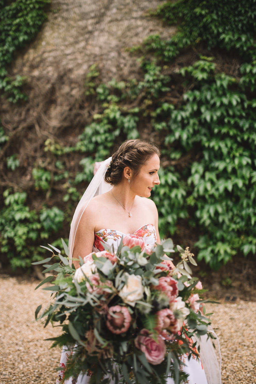 Bride Bridal Bouquet Flowers Greenery Foliage Large Protea Wild Whimsical Natural Irnham Hall Wedding Lucie Watson Photography