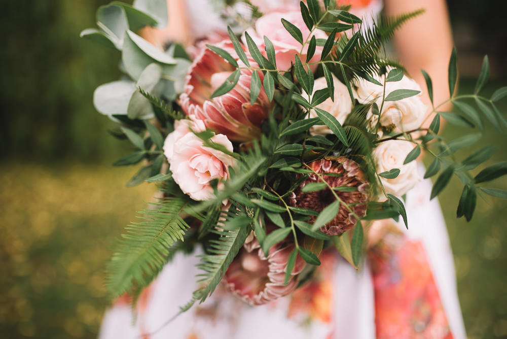 Bride Bridal Bouquet Flowers Greenery Foliage Large Protea Wild Whimsical Natural Fern Irnham Hall Wedding Lucie Watson Photography