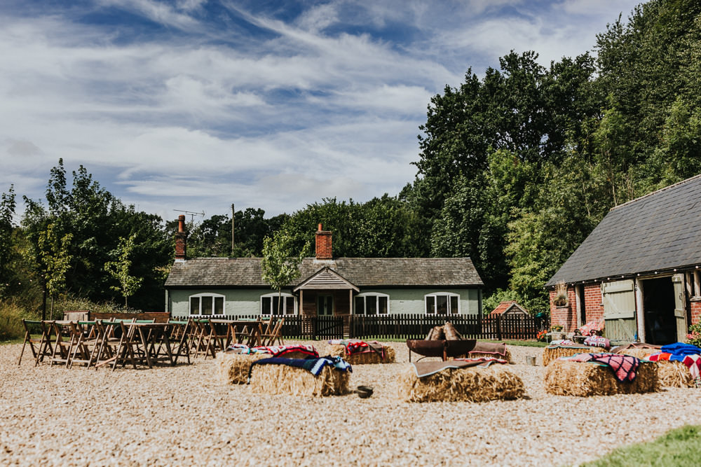 Keeper and The Dell Boho Farm Field Marquee DIY Alternative Rustic Hay Bales Fire Pit Blankets | Relaxed Outdoor Wedding with 1000 Rainbow Origami Cranes Dan Biggins Photography