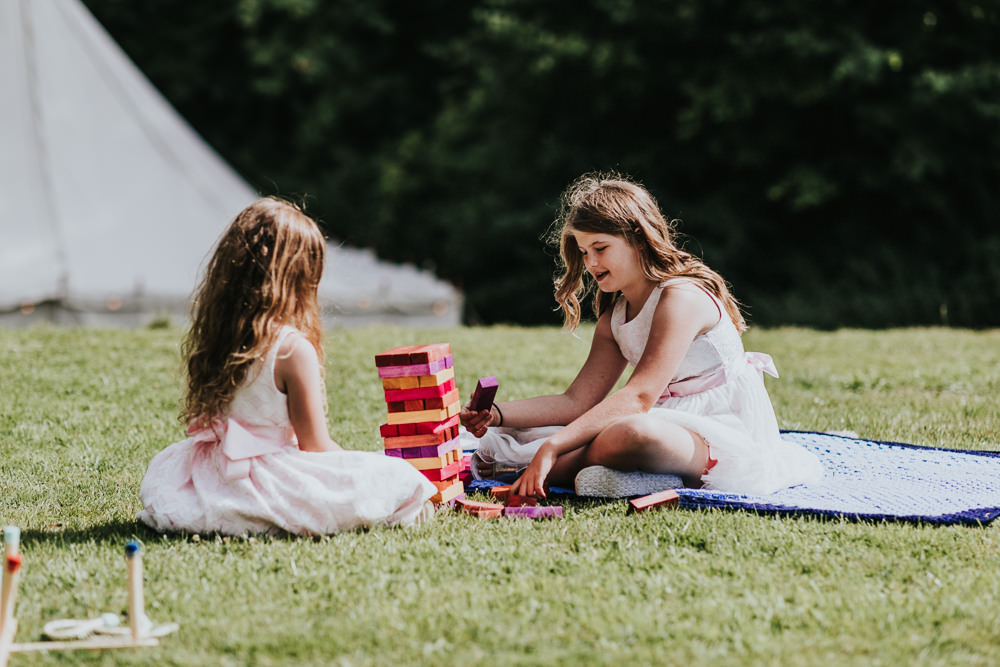 Keeper and The Dell Boho Farm Field Marquee DIY Alternative Rustic Outdoor Garden Games Jenga Kids | Relaxed Outdoor Wedding with 1000 Rainbow Origami Cranes Dan Biggins Photography