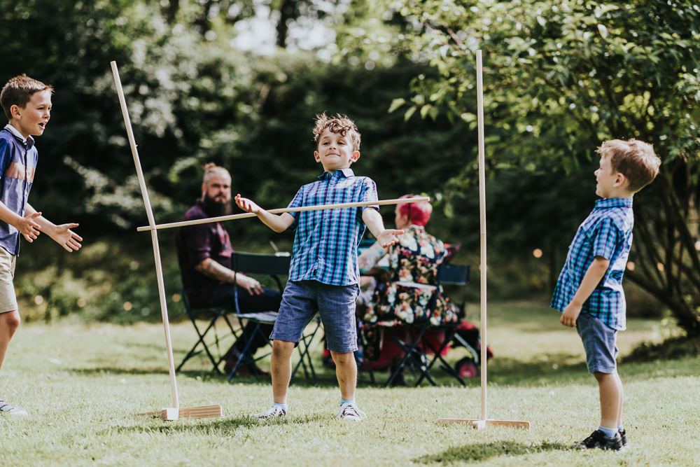 Keeper and The Dell Boho Farm Field Marquee DIY Alternative Rustic Outdoor Garden Games Limbo Kids | Relaxed Outdoor Wedding with 1000 Rainbow Origami Cranes Dan Biggins Photography