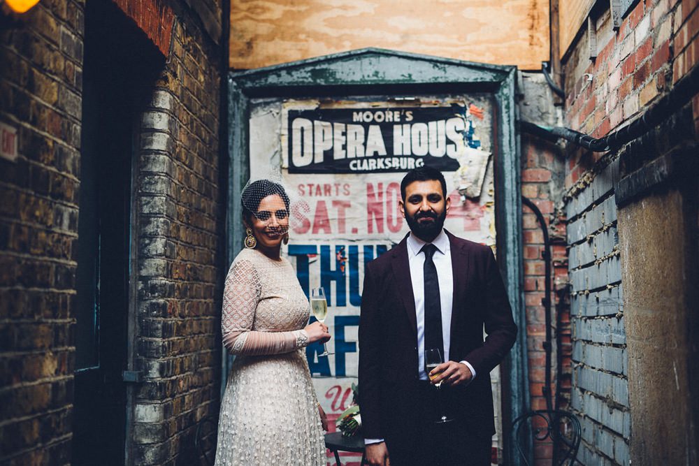 Bride Bridal Ivory Gold Indian Dress Embellished Long Sleeved Birdcage Veil Burberry Ox Blood Burgundy Suit Groom MC Motors Wedding LoveStruck Photography