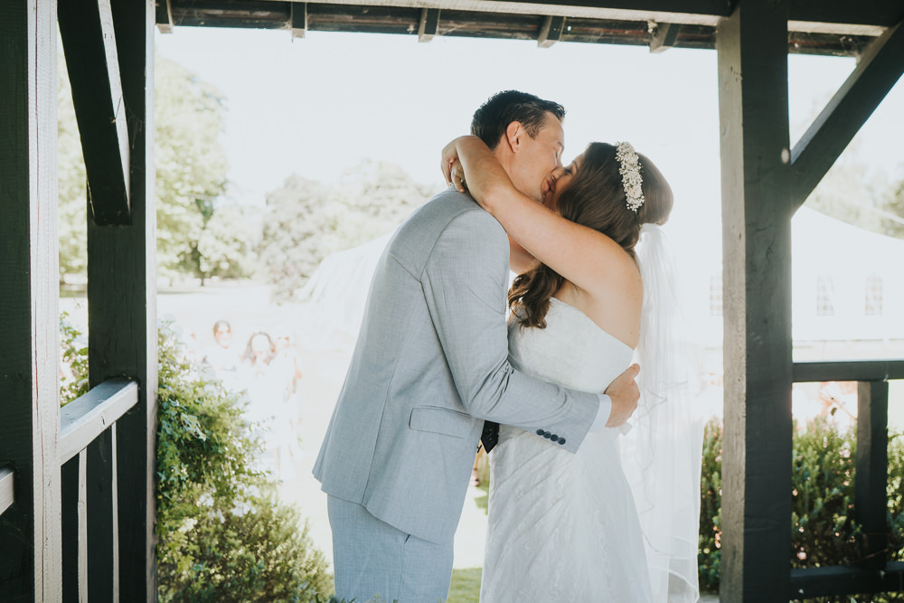 Intimate Outdoor Natural Relaxed Laid Back Summer Gazebo Ceremony Aisle Groom Bride Kiss | Prested Hall Wedding Grace Elizabeth Photography