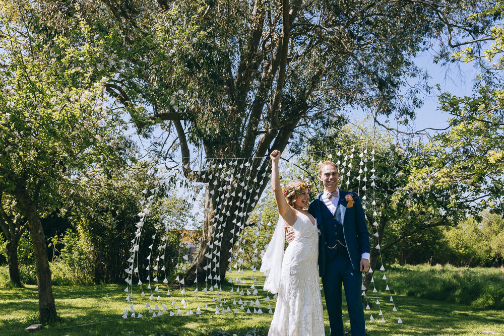 Paper Backdrop Garland Tree Ceremony Outdoor Rue De Seine Wedding Dress Bride Curious Rose Photography