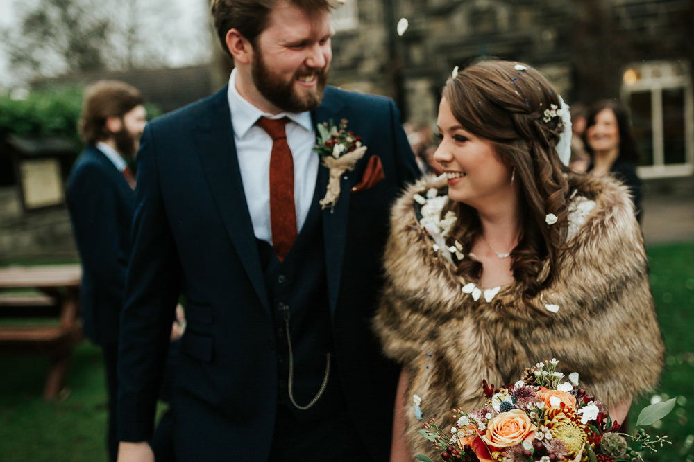 Bride Bridal Dress Cape Sleeve V Neck Lace Embellished Groom Burnt Orange Tie Black Suit Fur Stole Cape Confetti Cubley Hall Wedding Photography by Charli