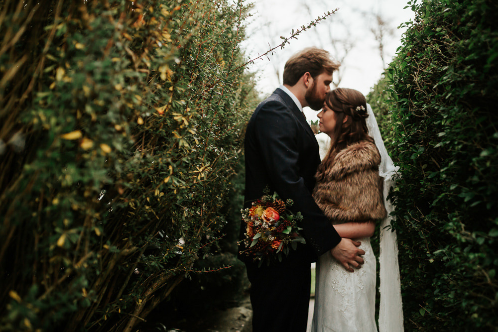Bride Bridal Dress Cape Sleeve V Neck Lace Embellished Groom Burnt Orange Tie Black Suit Fur Stole Cape Veil Cubley Hall Wedding Photography by Charli