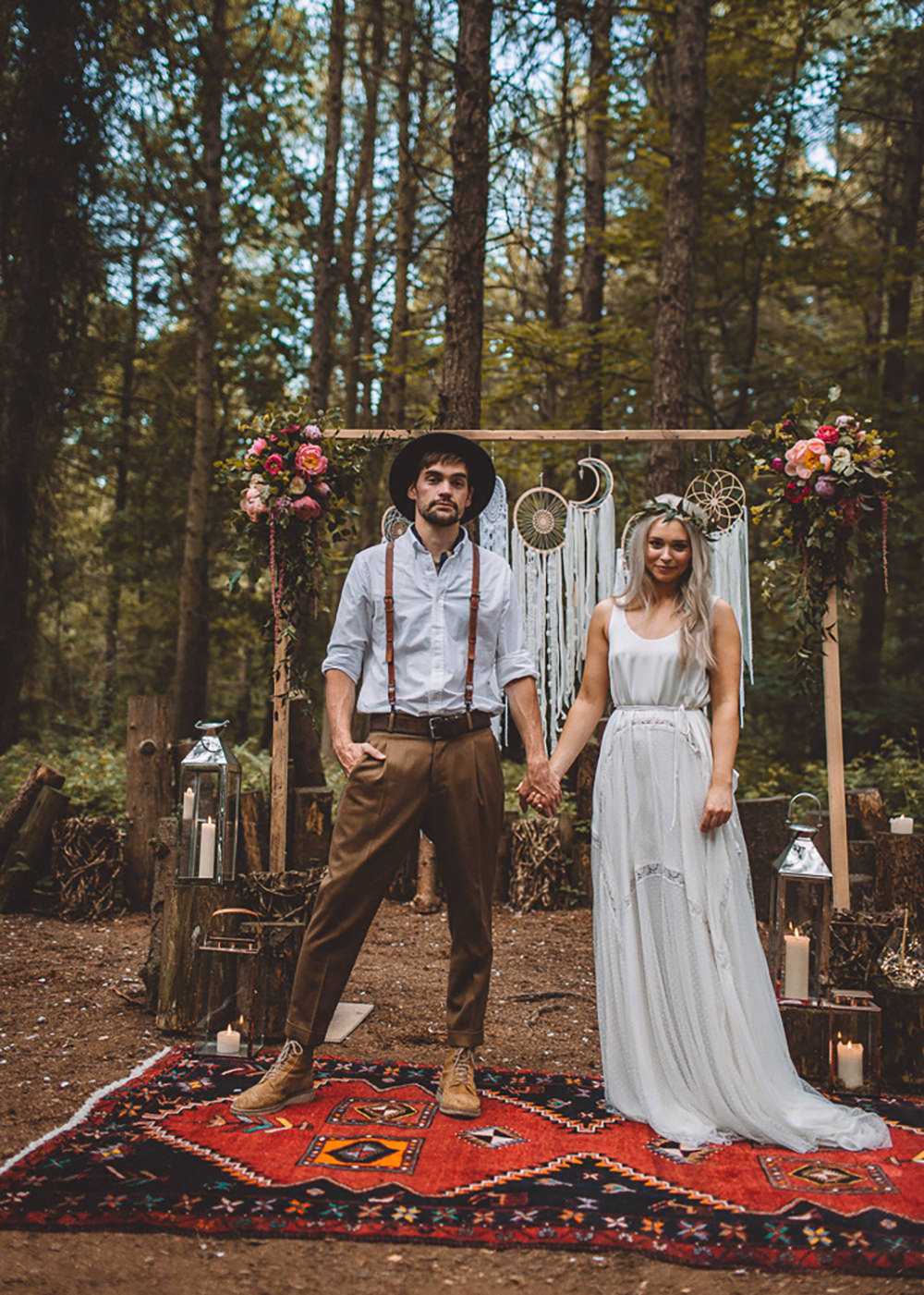 Ceremony Backdrop Wooden Frame Log Stumps Candles Persian Rug Aisle Dreamcatchers Flowers Bohemian Boho Free Spirited Wedding Ideas Woodland Lumiere Photographic