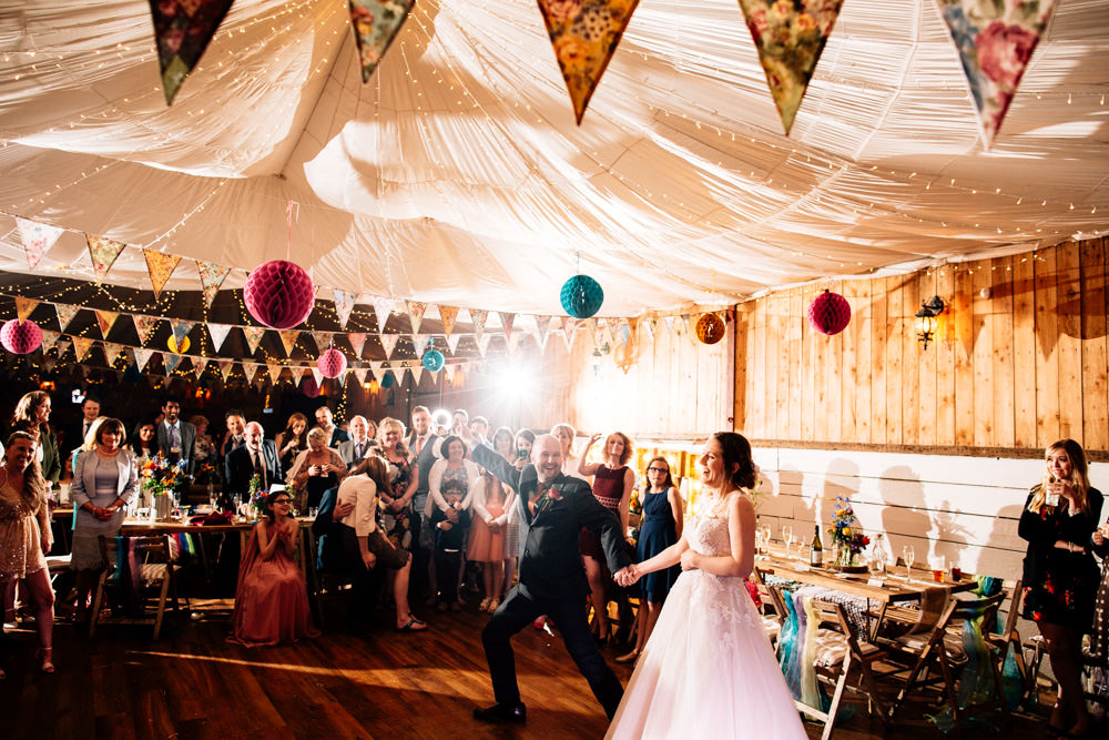 Bride Bridal Lace Tulle Full Skirt Sweetheart Illusion Navy Suit Orange Tie Groom Multicoloured Paper Lanterns Bunting Parachute Ceiling Fun Quirky Colourful Wedding Fairclough Studios