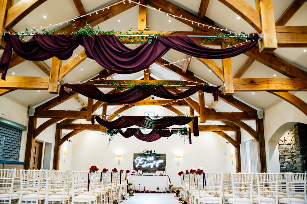 Burgundy Red Drapes Ceiling Fabric Fairy Lights Aisle Chair Flowers Ribbons Ceremony Gamekeepers Inn Wedding Fairclough Studios