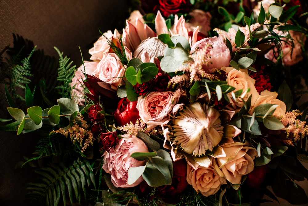 Bouquet Flowers Bride Bridal Red Pink Burgundy Protea Rose Asilbe Peony Fern Gamekeepers Inn Wedding Fairclough Studios