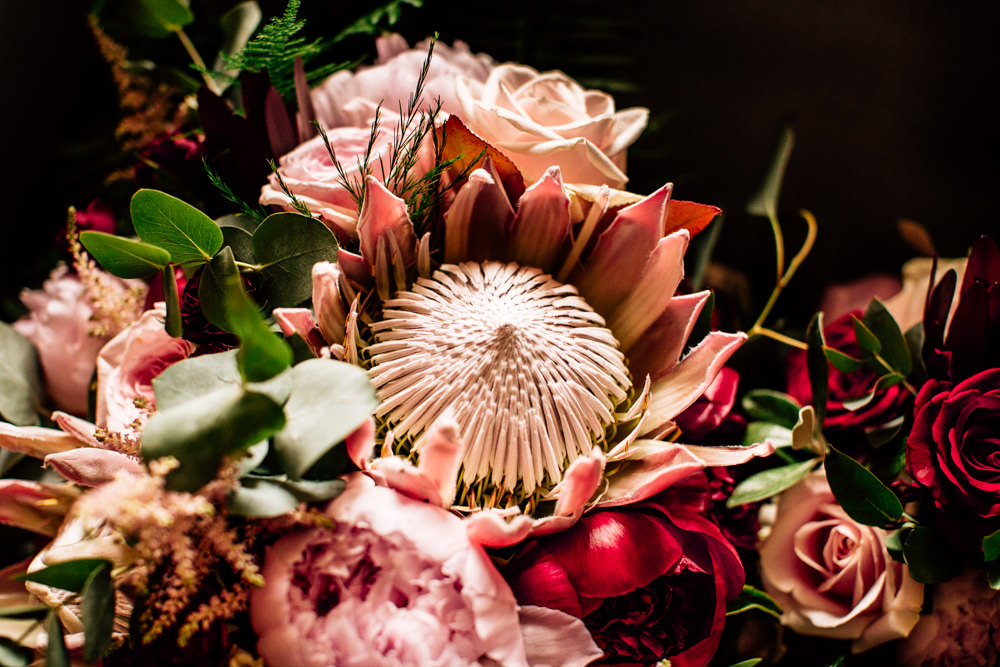 Bouquet Flowers Bride Bridal Red Pink Burgundy Protea Rose Asilbe Peony Fern Gamekeepers Inn Wedding Fairclough Studios