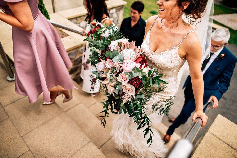 Bouquet Flowers Bride Bridal Red Pink Burgundy Protea Rose Asilbe Peony Fern Gamekeepers Inn Wedding Fairclough Studios