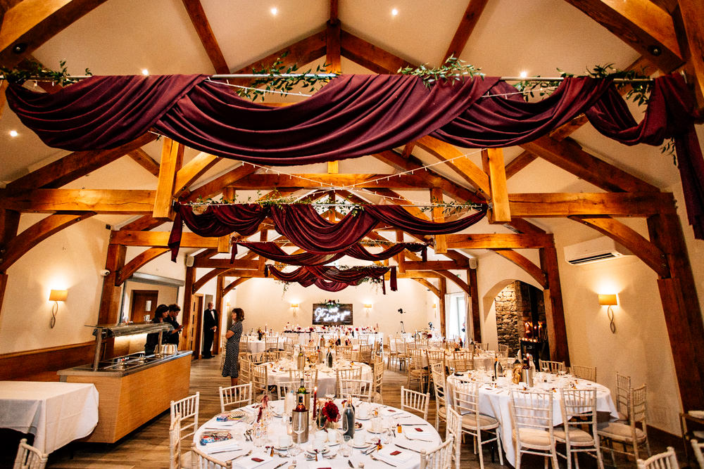 Burgundy Red Drapes Ceiling Fabric Fairy Lights Flowers Reception Gamekeepers Inn Wedding Fairclough Studios