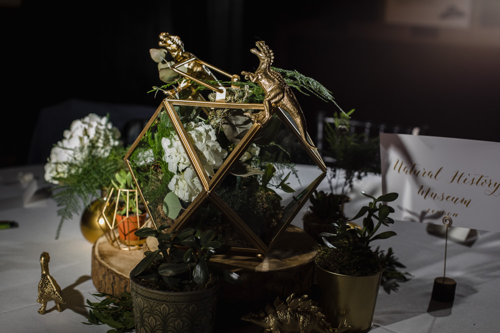 Table Centre Gold Dinosaur Terrarium Greenery Wood Slice Manchester Museum Wedding Chris Barber Photography