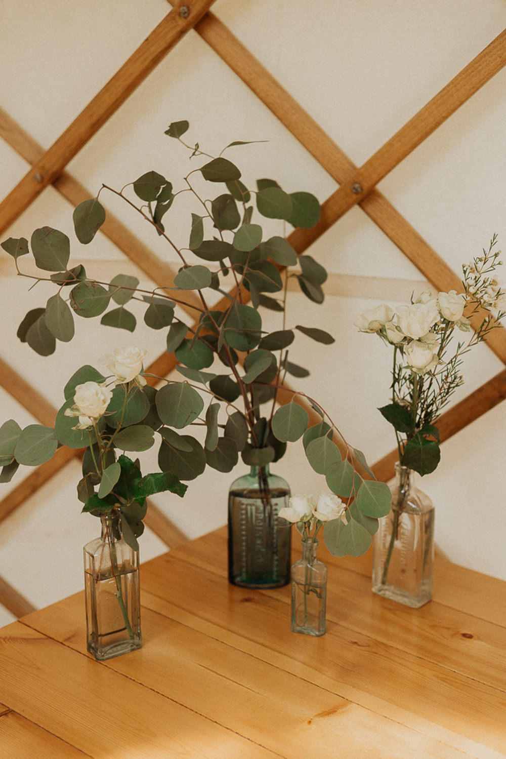 Bottles Flowers Greenery Foliage Eucalyptus Riverside Weddings Oxfordshire Yurt Luis Calow Photographer