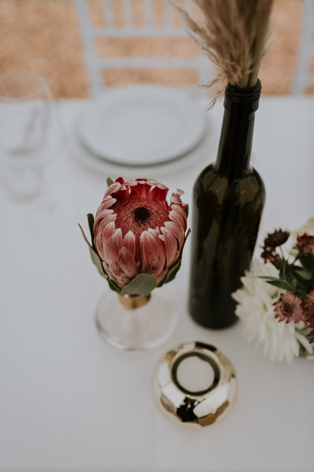 Protea Table Flowers Bottle Slovenia Wedding Bohemian Maja Tsolo Photography
