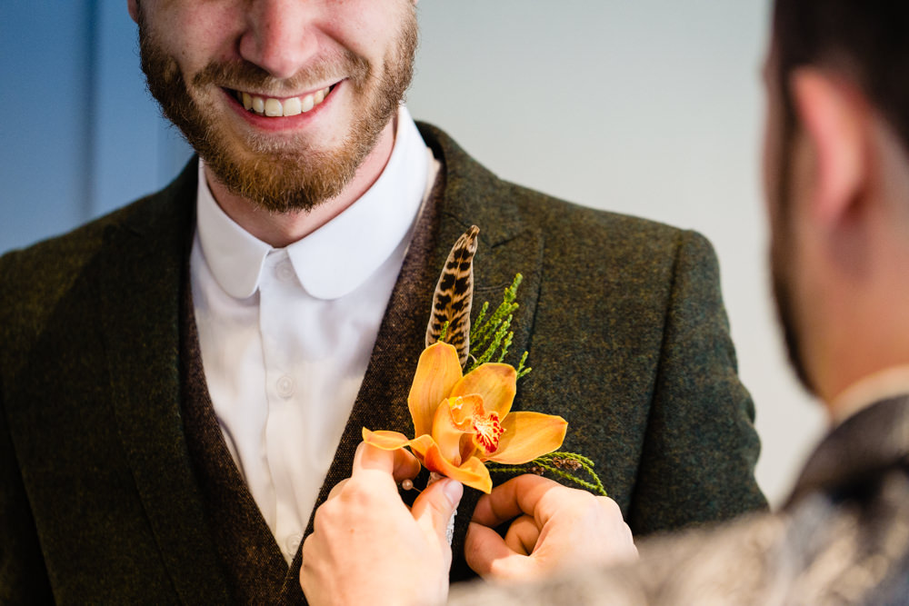 SButtoButtonhole Flowers Orchid Feather Groom Groomsmen Stepney Hill Farm Wedding Emma + Rich Photography