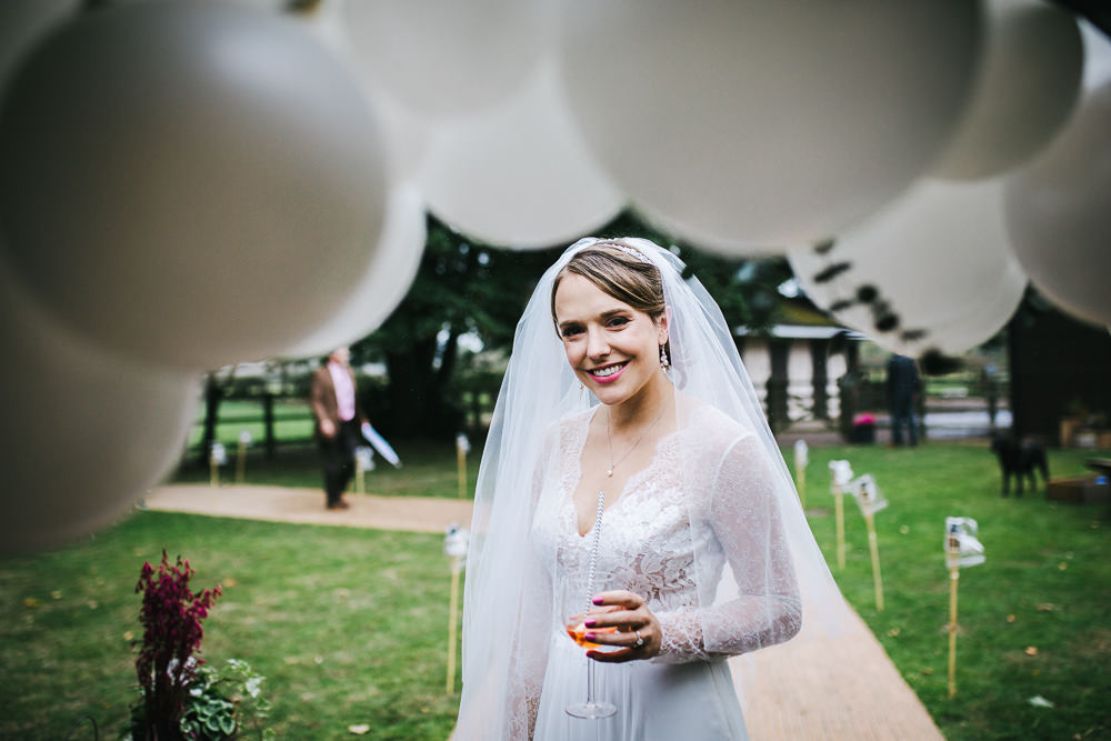 Dress Gown Bride Bridal Long Sleeves Tulle Skirt Train Balloons Tipi Garden Wedding Amy Jordison Photography