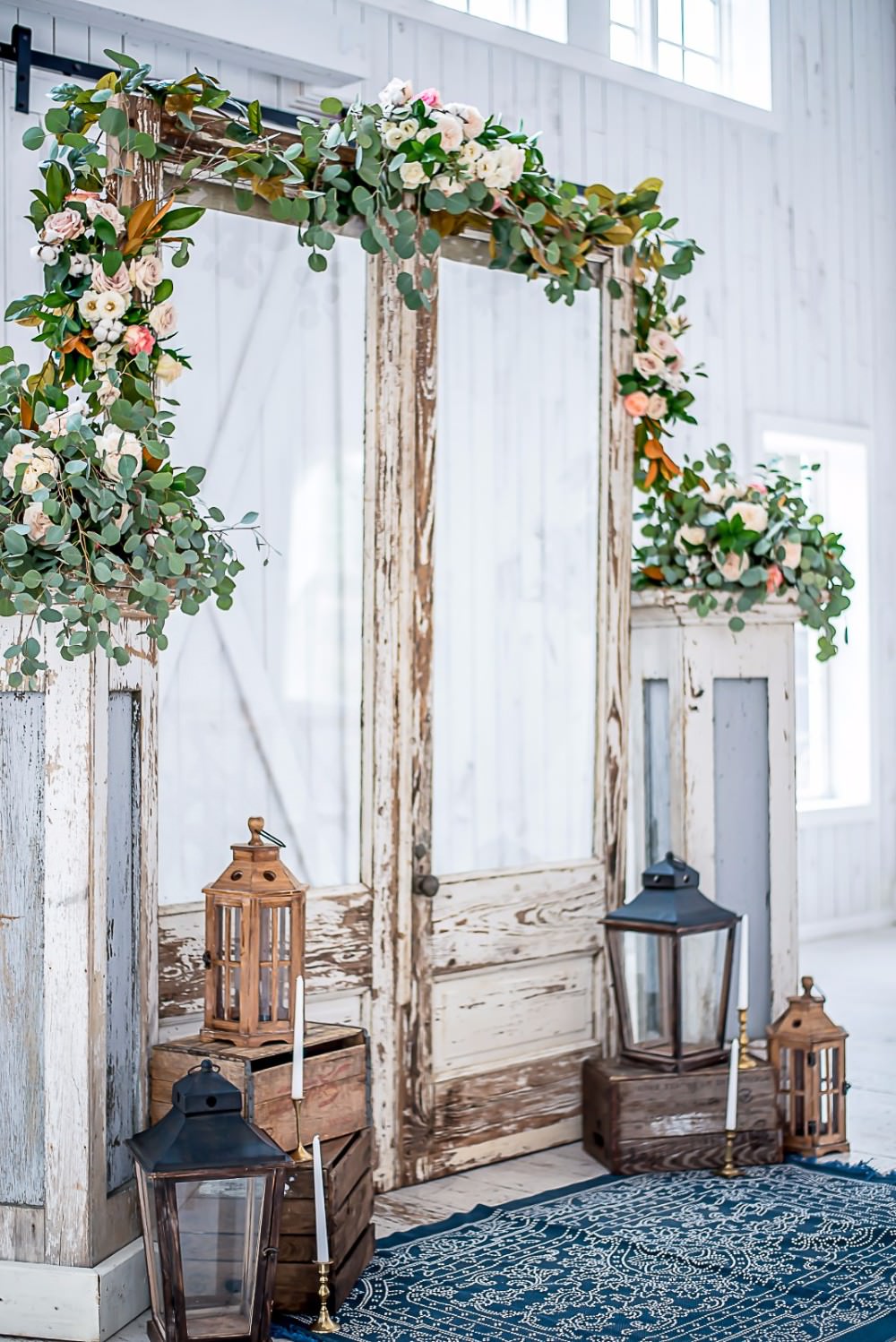 Ceremony Archway Foliage Floral Pedestal Storm Lantern White Sparrow Barn Wedding White Blue Ideas Si Creative Photography