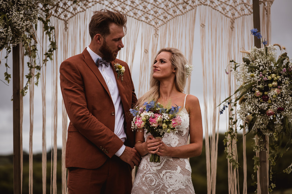 Bride Bridal Grace Loves Lace Rosa Sleeveless Dress Gown Boho Macrame Floral Flowers Gypsophila Ceremony Backdrop Tan Suit Bow Tie Groom Wilkswood Farm Wedding Robin Goodlad Photography