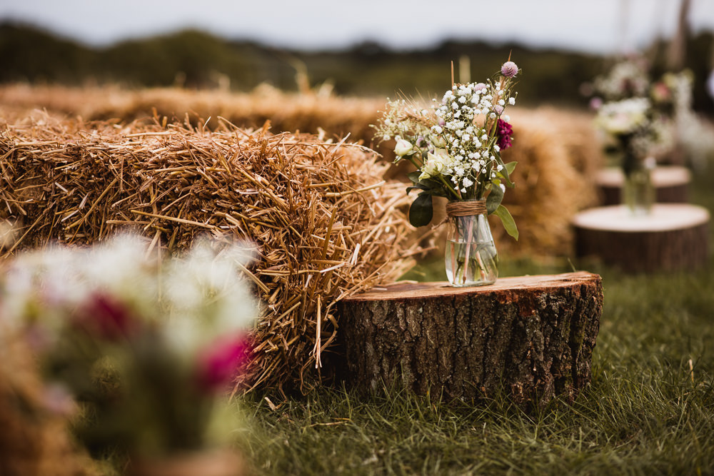 Aisle Ceremony Tree Trunks Jar Flowers Floral Straw Bale Wilkswood Farm Wedding Robin Goodlad Photography