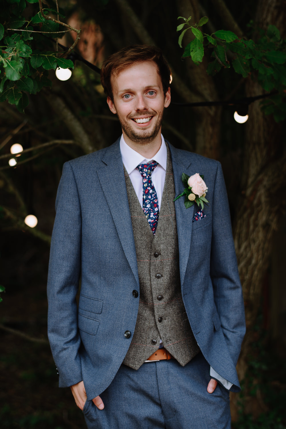 Groom Navy Suit Grey Waistcoat Floral Tie Rose Buttonhole Boho Festival Wedding Matt Bowen Photography
