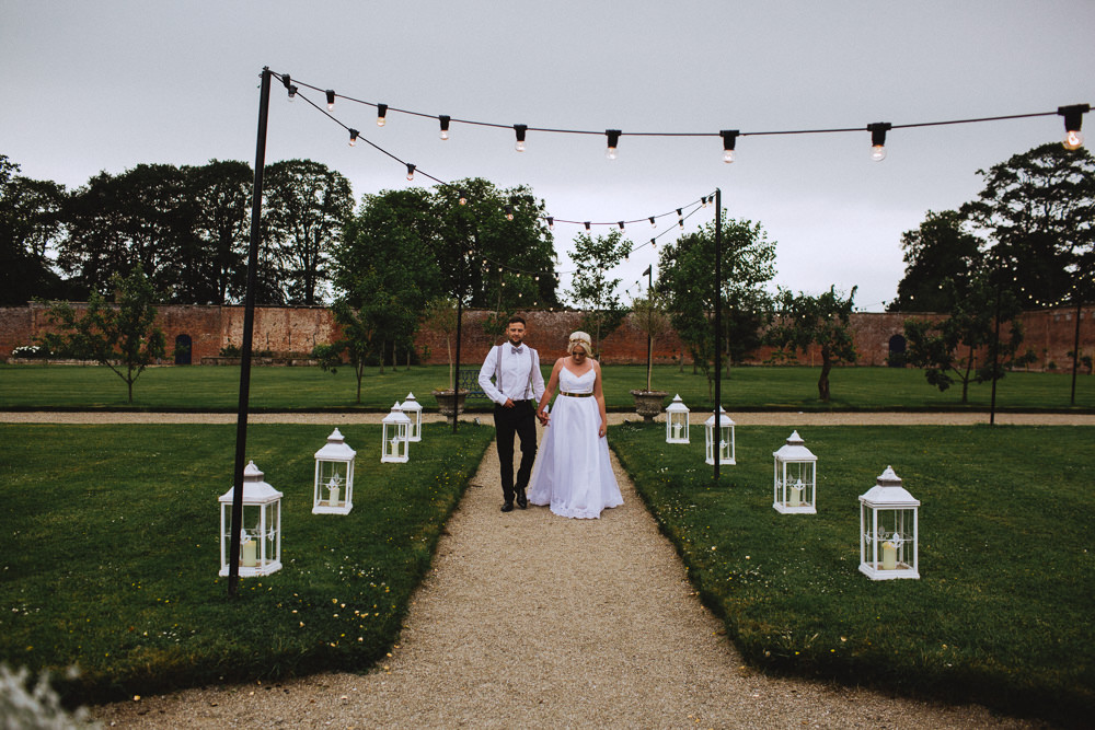 Bride Bridal Dress Strappy Gold Belt Bow Tie Braces Groom Festoon Lighting Lanterns Drenagh House Estate Wedding Monochrome Honey and the Moon Photography