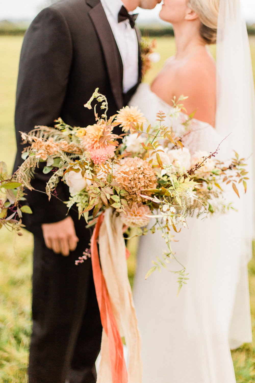 Bouquet Flowers Bride Bridal Peach Apricot Pink Blush Dahlias Rose Greenery Ribbons Fabric Foliage Unstructured Wild Autumn Fine Art Farm Wedding Ideas Seyi Rochelle Photography