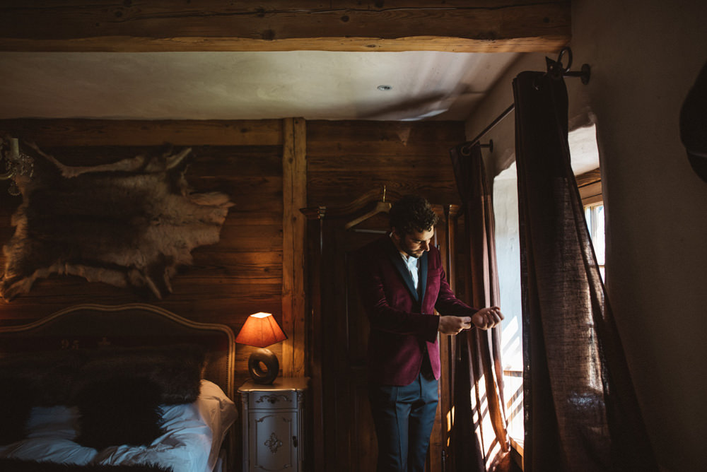 Groom Suit Red Burgundy Velvet Jacket Bow Tie French Alps Folk Boho Mountain Wedding Ideas Katja & Simon Photography