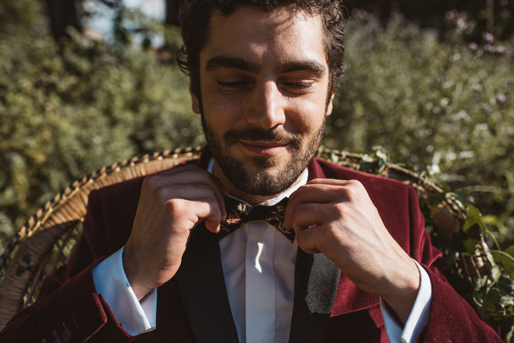 Groom Suit Red Burgundy Velvet Jacket Bow Tie French Alps Folk Boho Mountain Wedding Ideas Katja & Simon Photography
